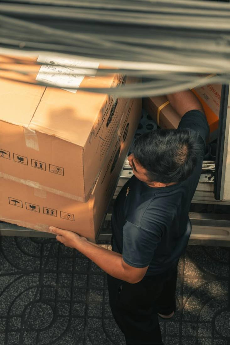 Mover loading and unloading packed cartons with care
